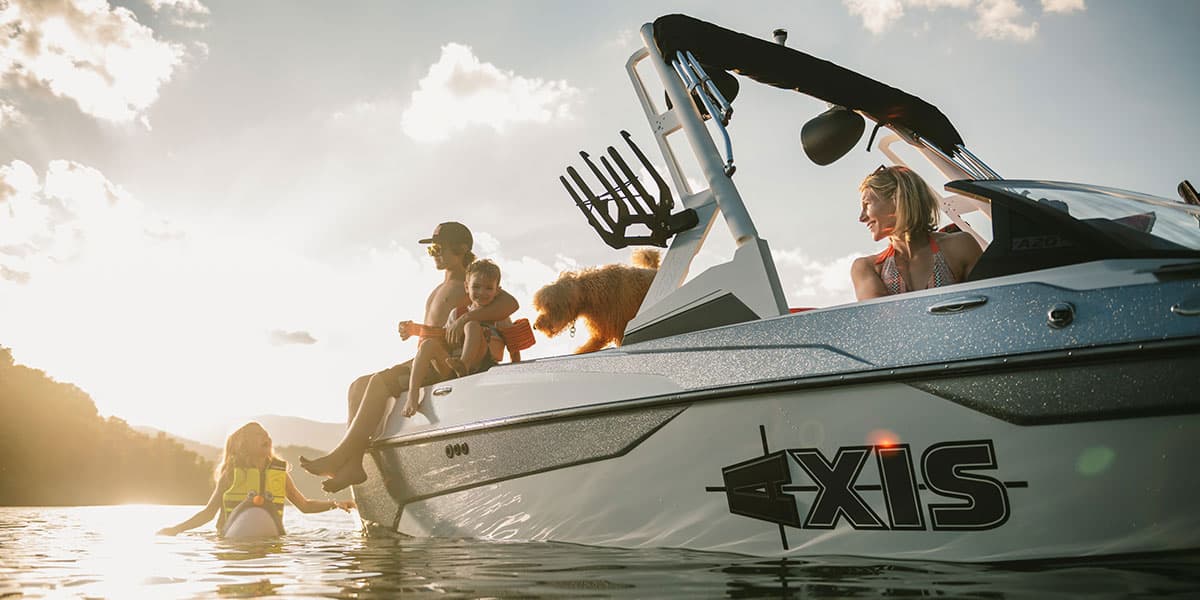 A family and dog on an Axis boat.