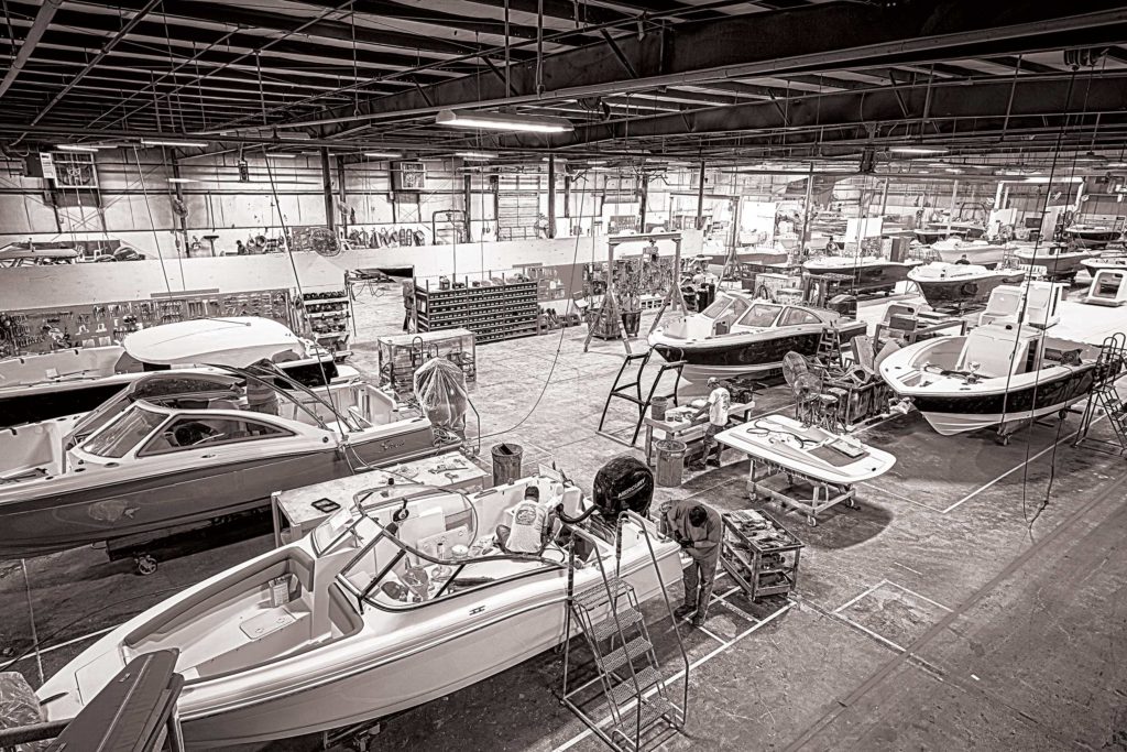 Boats being built inside the Scout plant