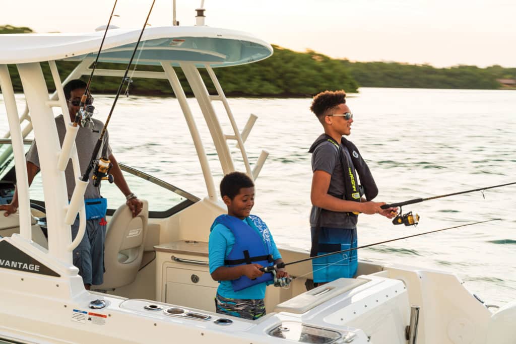 Boston Whaler 240 Vantage fishing with family