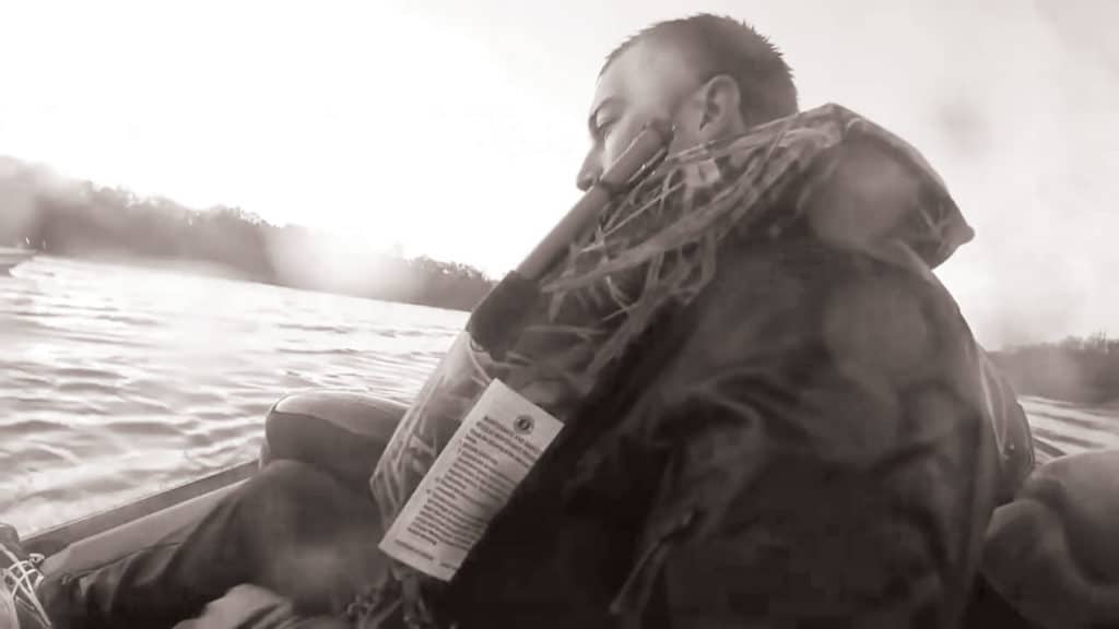 Fisherman wearing an inflatable life jacket