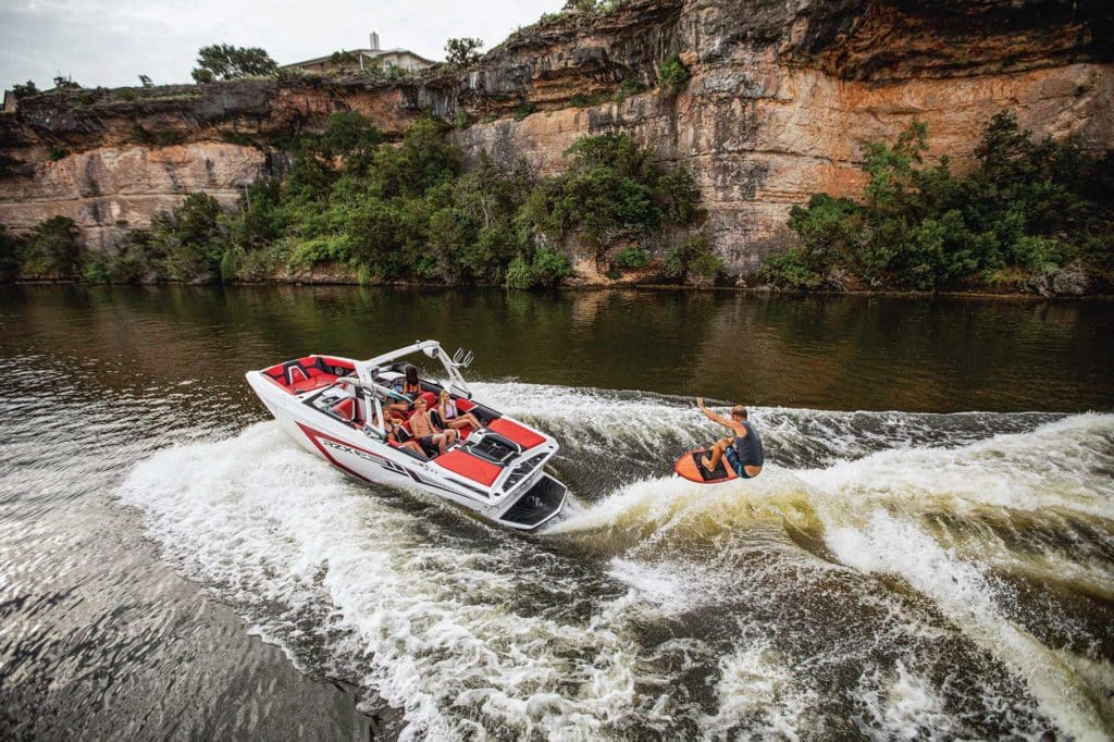 Tigé 20RZX launching on a wakesurf board