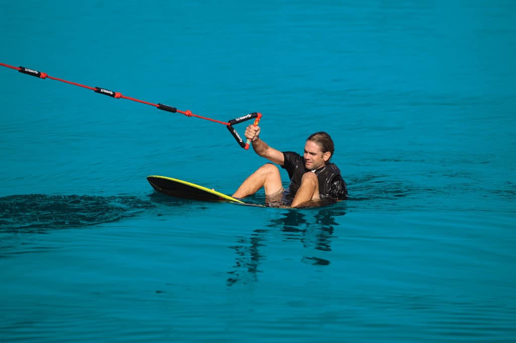 Wakesurfer getting ready to be pulled up