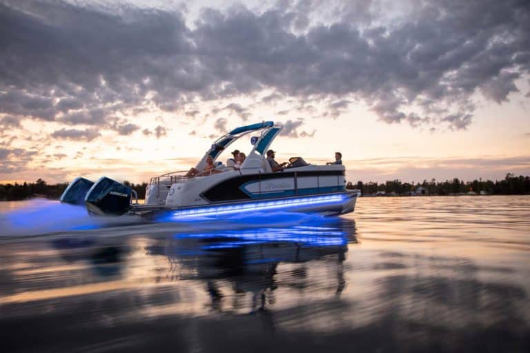 Manitou pontoon cruising on the lake