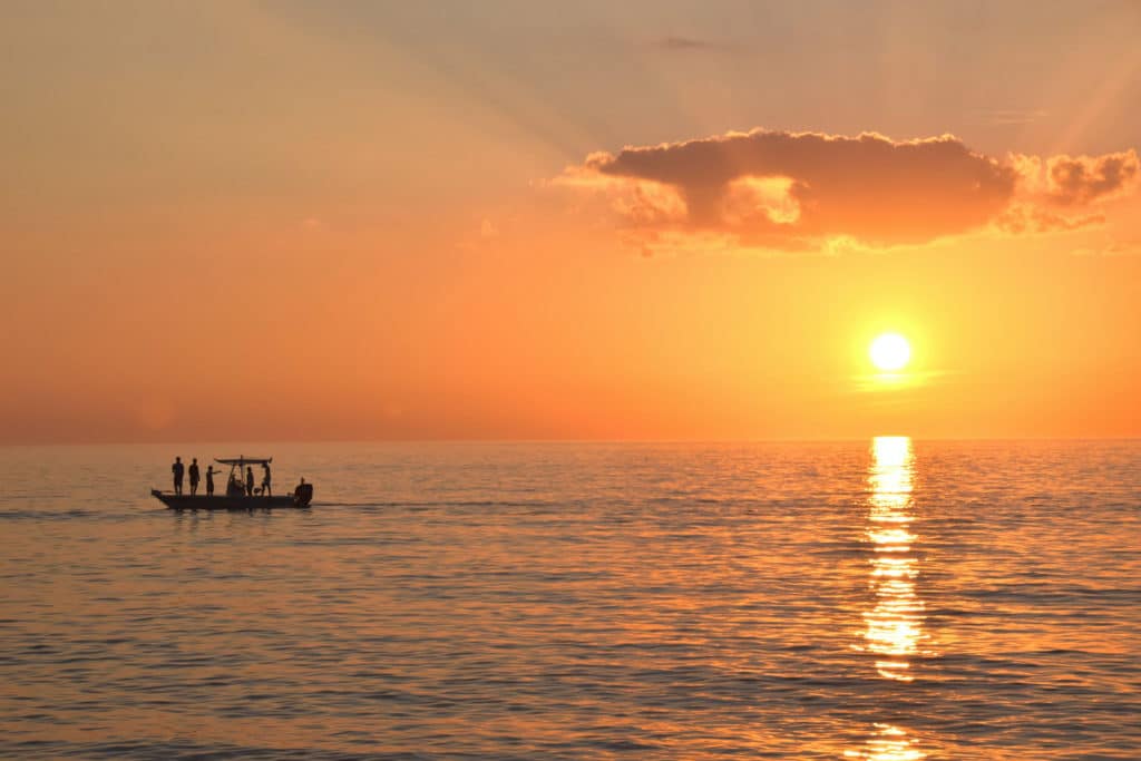 Sunrise over boaters