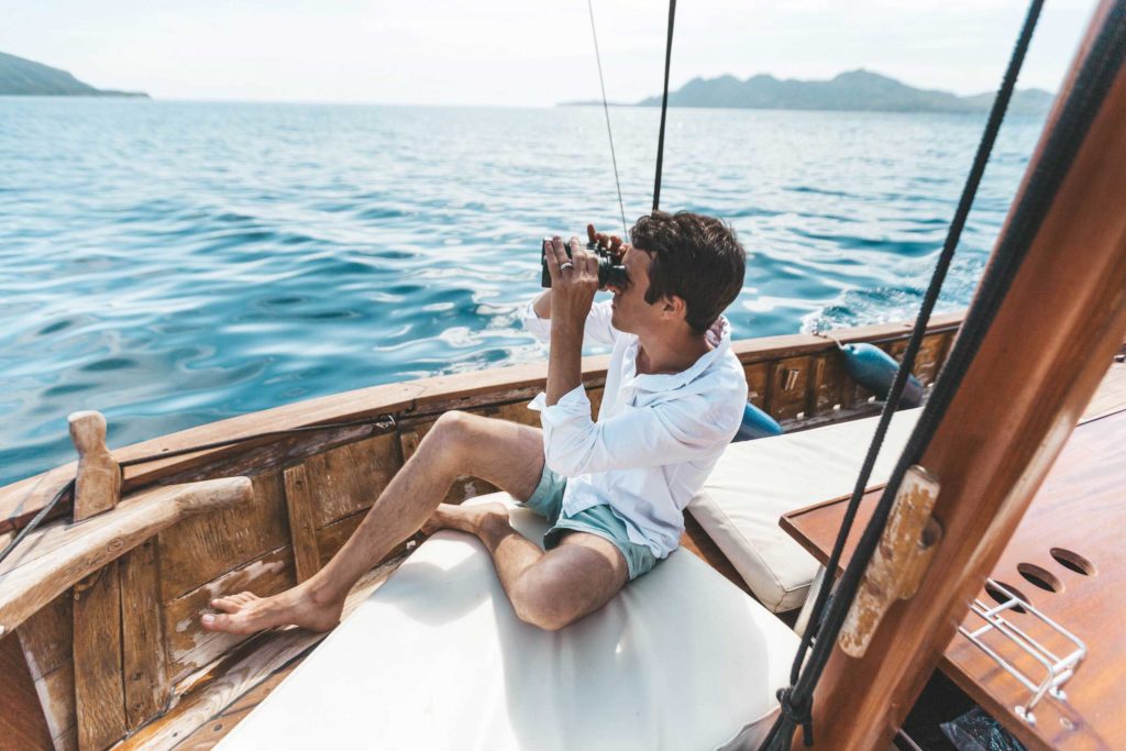 Using binoculars on a boat
