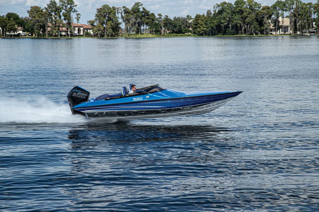 Velocity 230 SC skimming across the lake