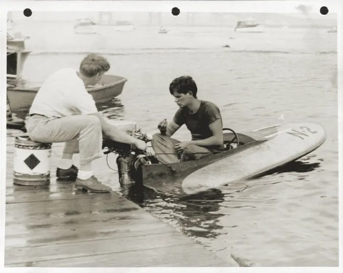 Charlie Strang examines spark plug