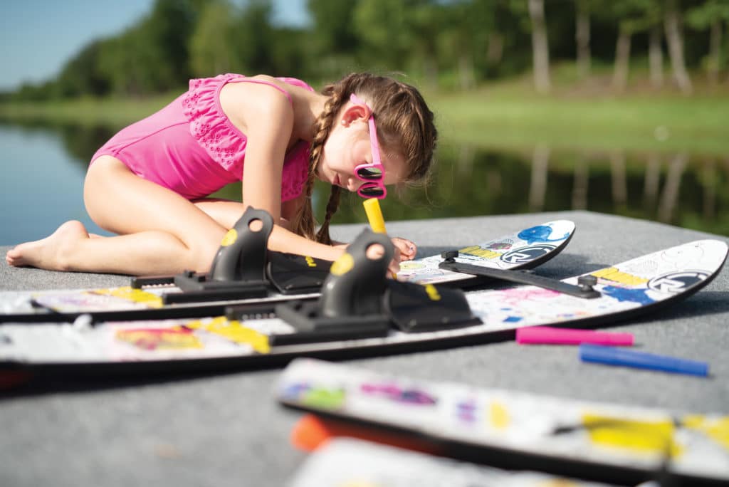 Kid checking out water skis