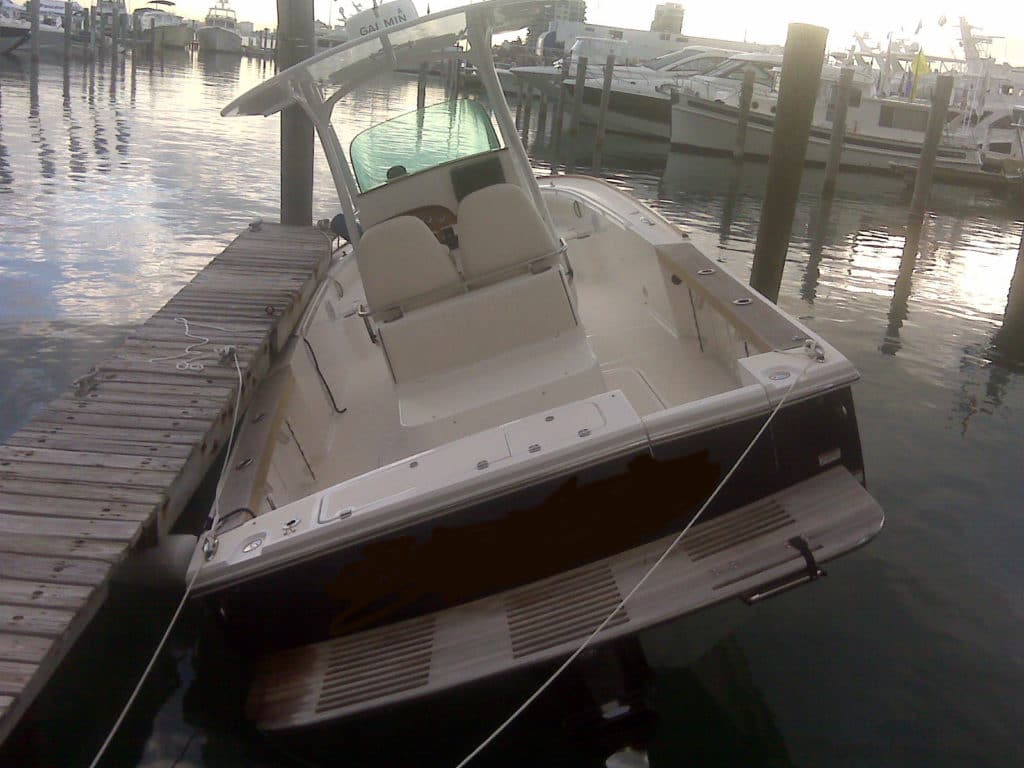 Boat Caught Under Dock