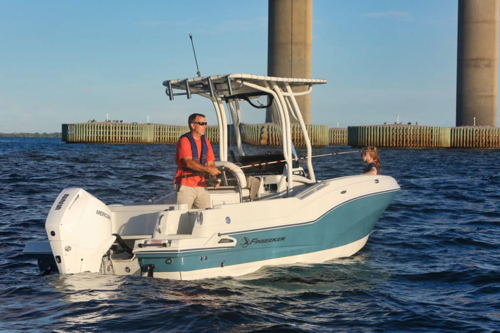 Finseeker 220 Center Console fishing under a bridge