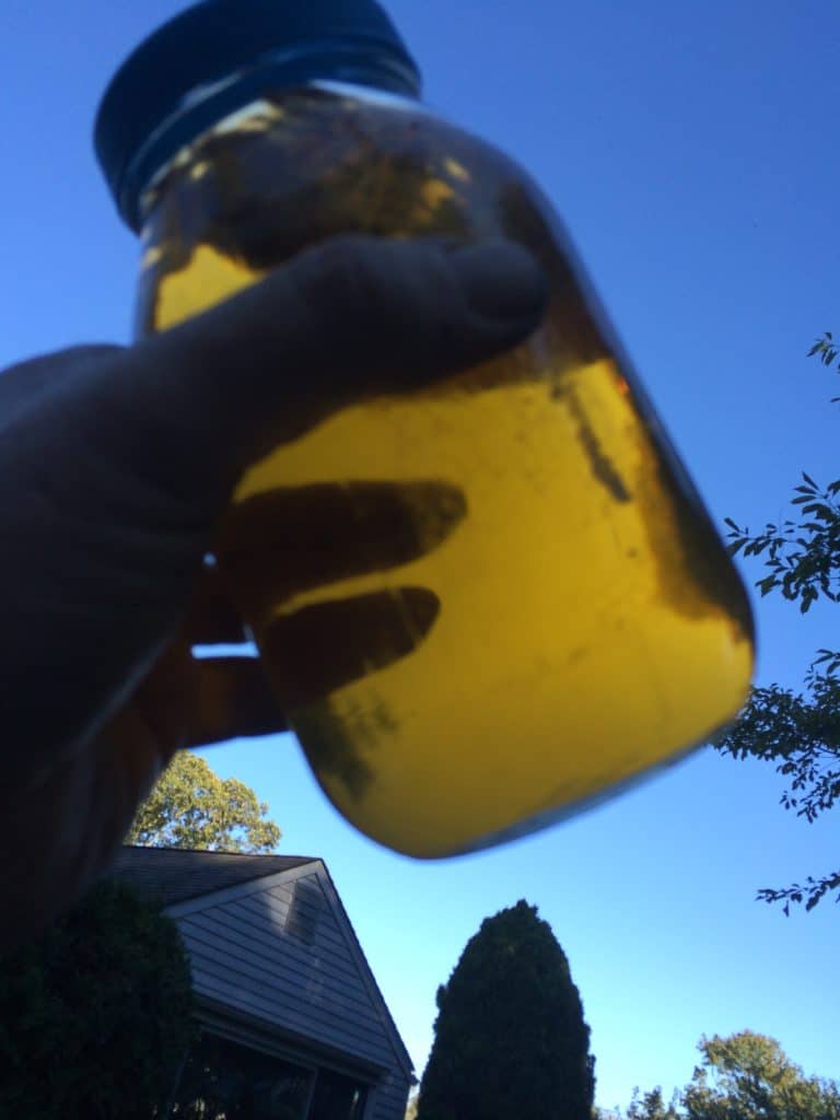 A clear jar can be used to evaluate water in fuel.