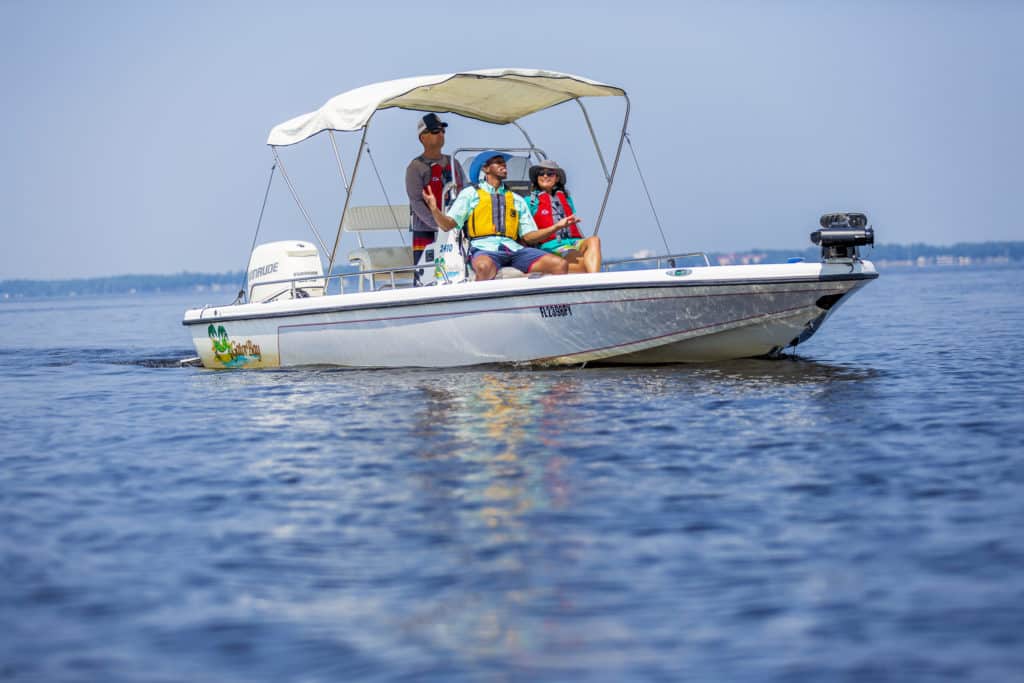 Family out boating on a bay boat