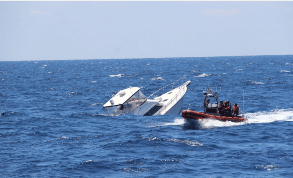 A Coast Guard Cutter Robert Yered small boat crew arrives on scene with the sinking vessel La Bella Saturday, April 28, 2018 approximately 13 miles northwest of Cat Cays, Bahamas. The cutter Robert Yered crew rescued two people who remained aboard the La