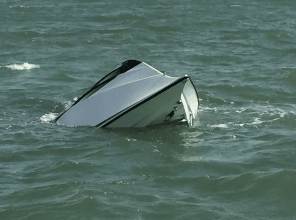 Sinking Boat from which three were rescued