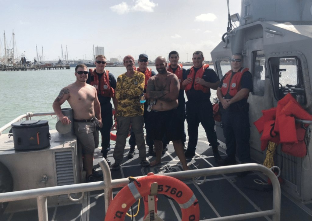 Rescued boaters are all smiles after being saved by US Coast Guard