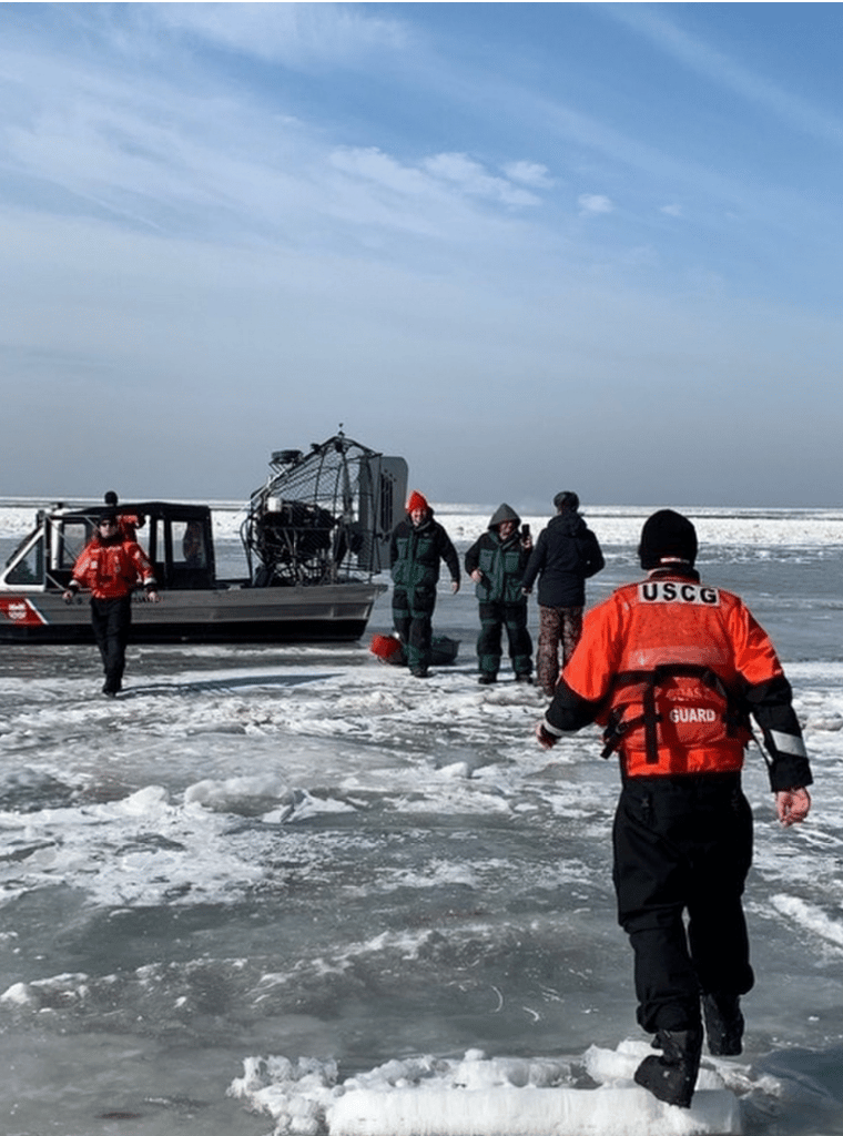USCG Personell help stranded ice anglers