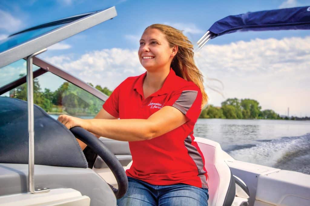 Kaitlyn Schneider driving a boat