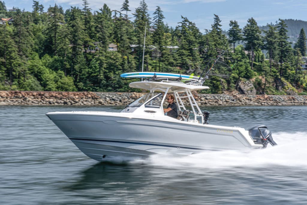 Cutwater C-24 CW running near the shore