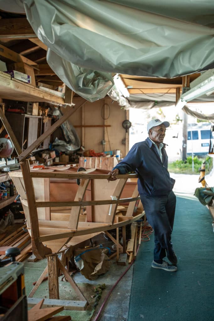 Ansil Saunders next to a boat