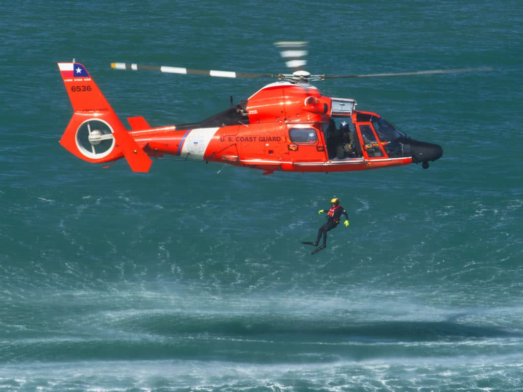 US Coast Guard diver with helicopter