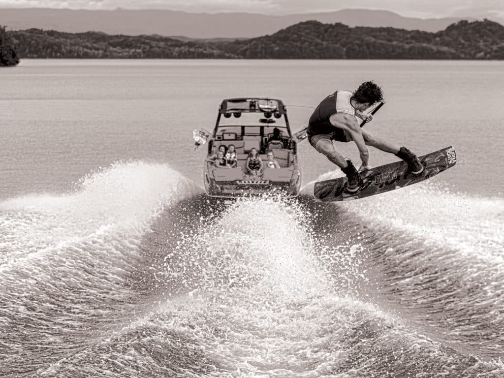 Wakeboarding behind a tow boat