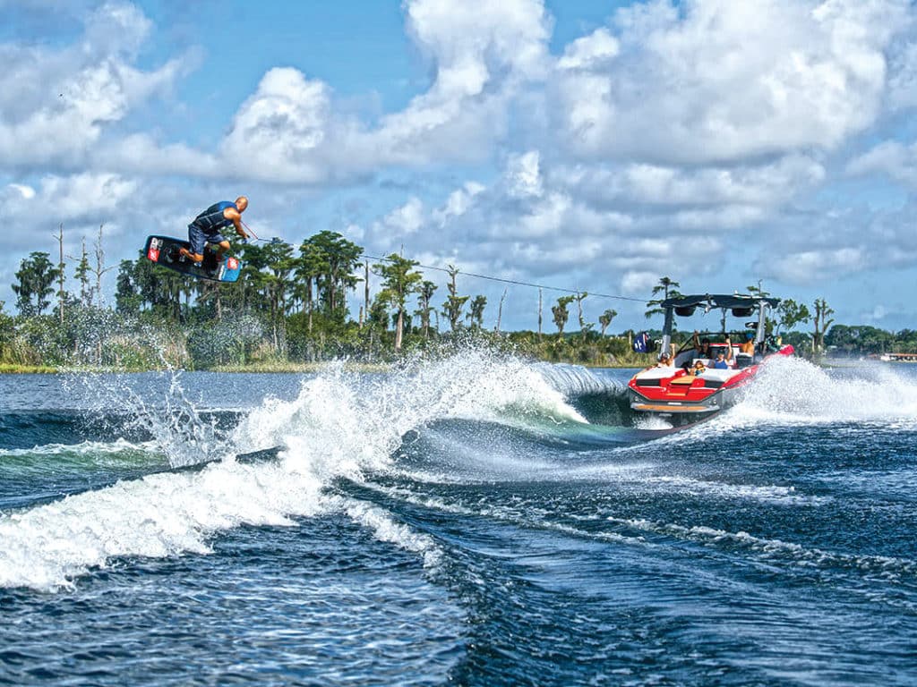 Wakeboarder launching over the wake