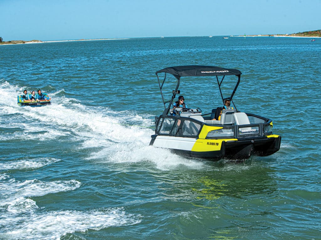 Sea-Doo boat pulling a tube