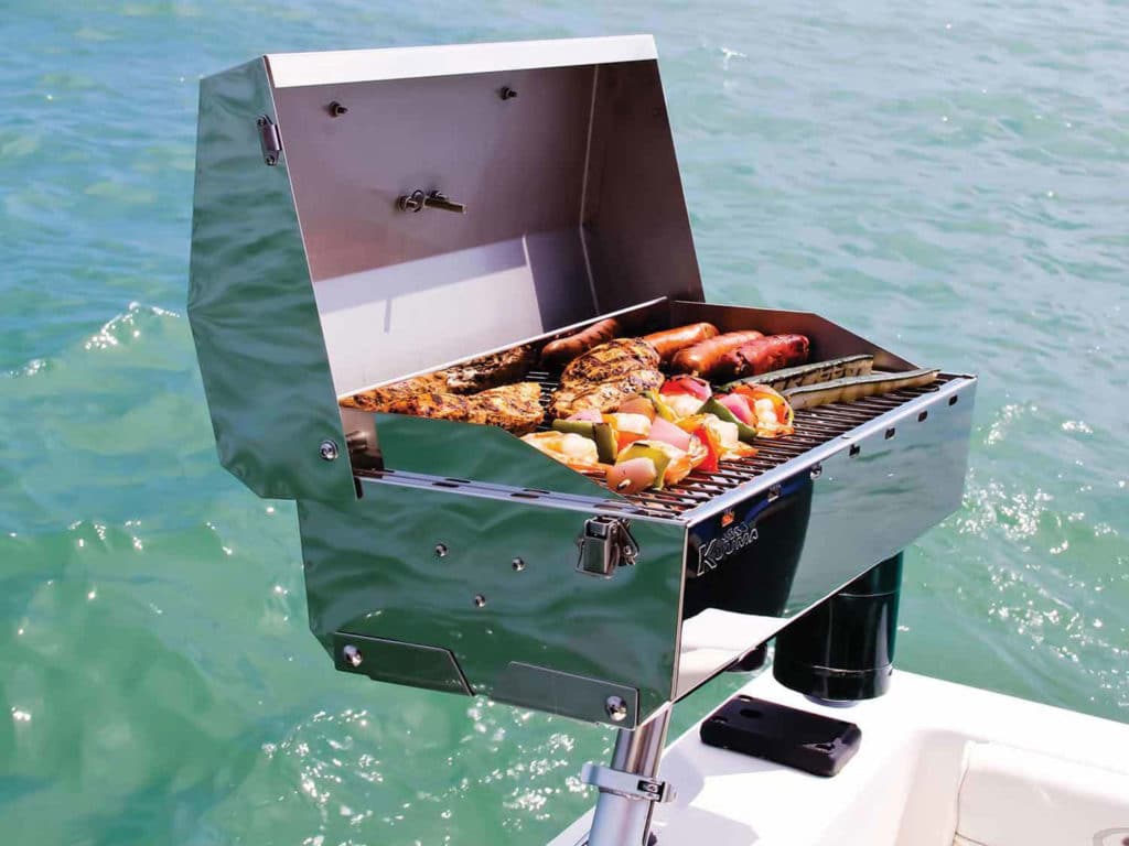 Grill mounted in boat's rod holder
