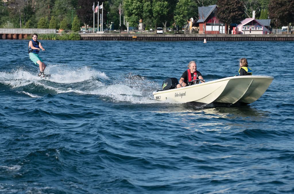 Electric Whaler pulling boarder
