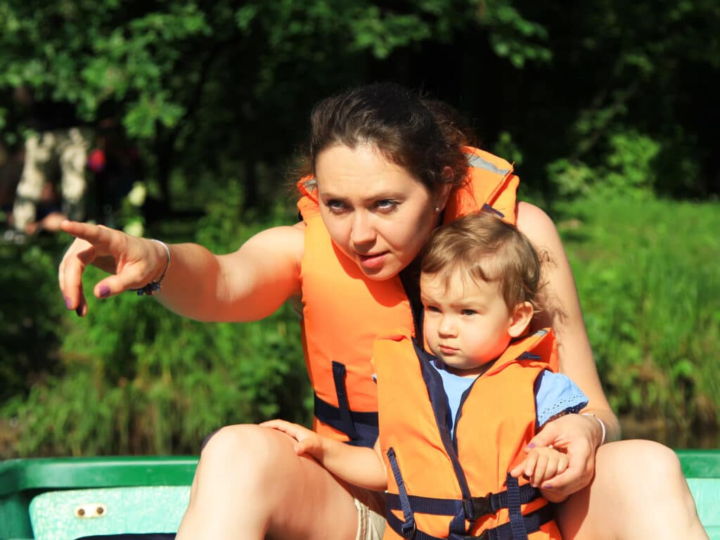 Mom with a child in a boat