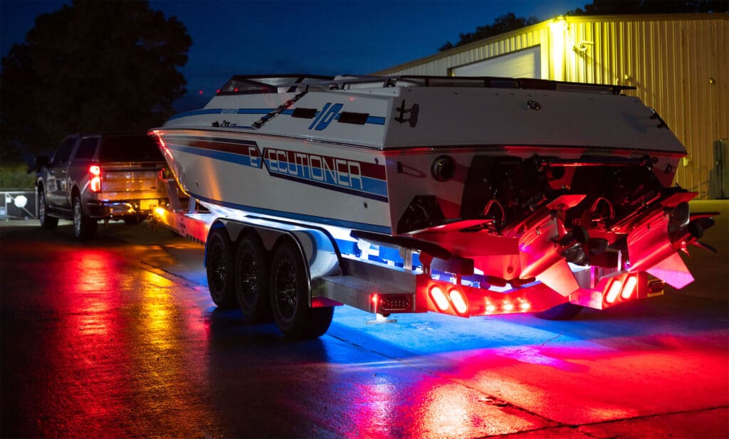 Boat lit at night on a trailer