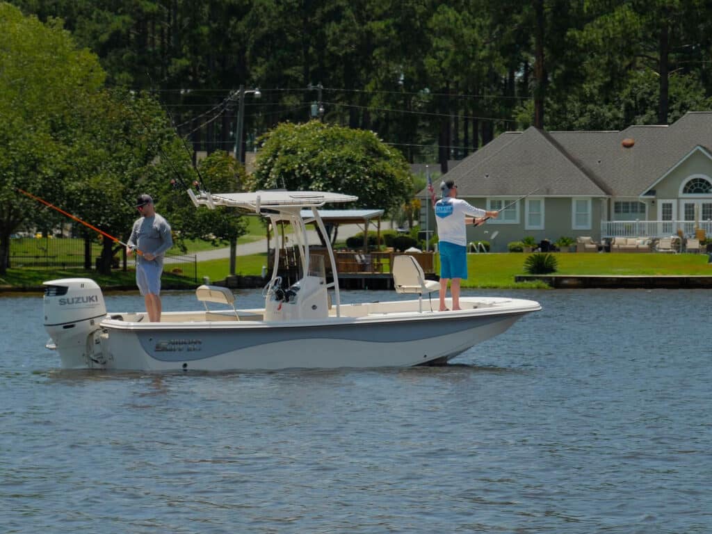 Anglers fishing near homes