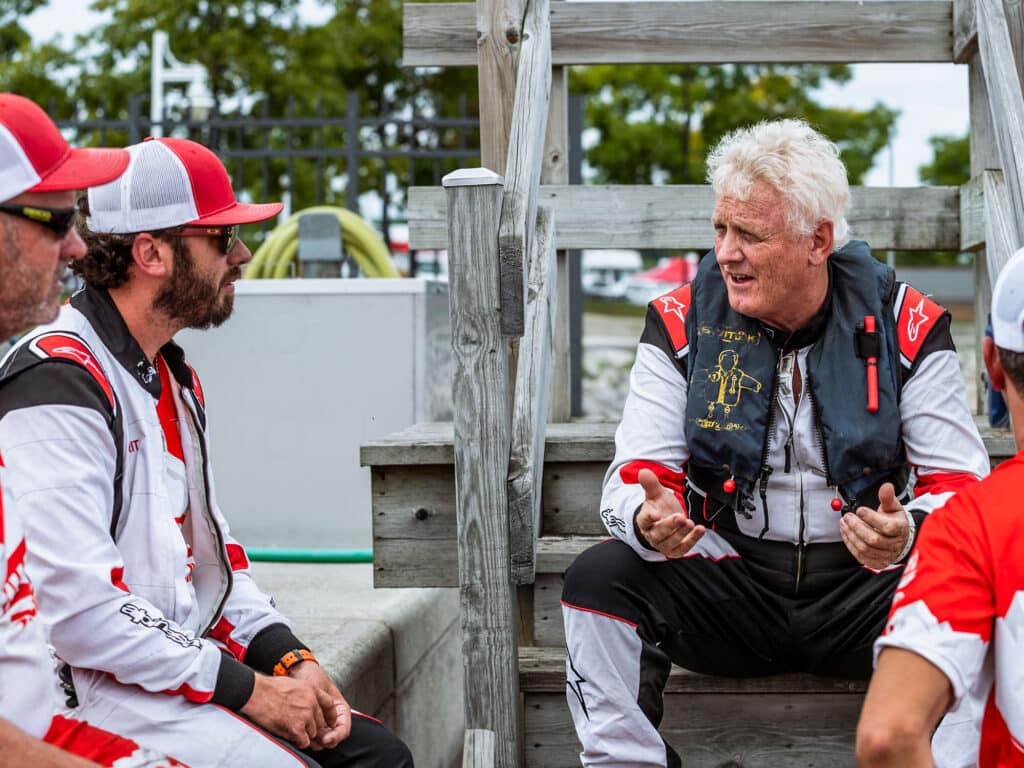 Boat racers discussing strategy