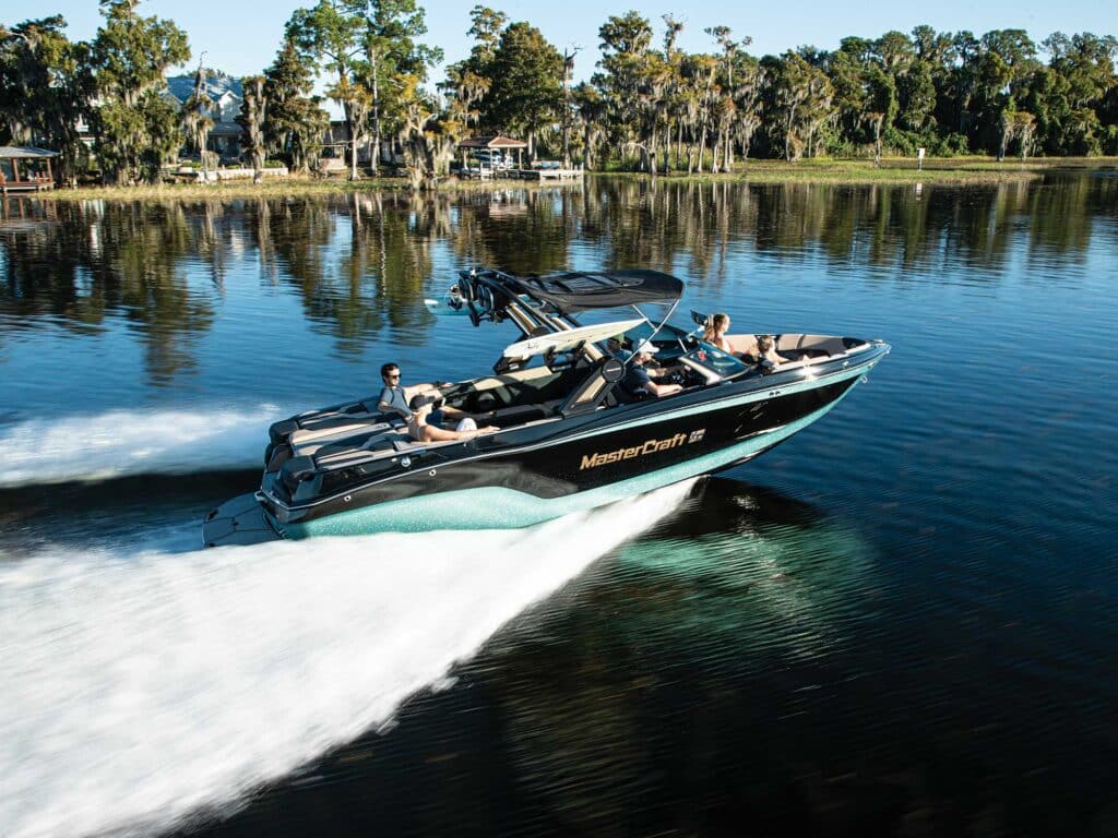 MasterCraft XT25 on a glassy lake