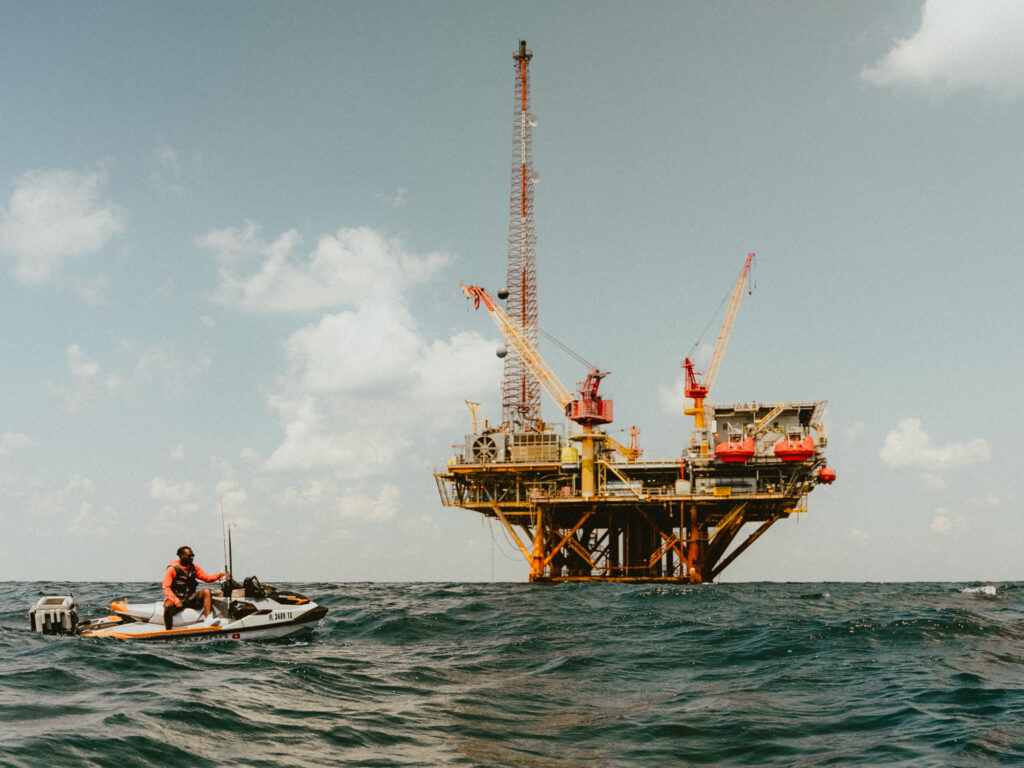 Emmanuel Williams trolling near a drilling platform