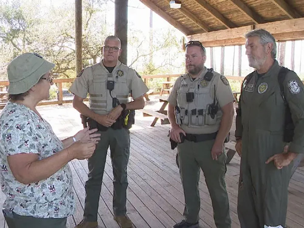 DeNell with FWC officers