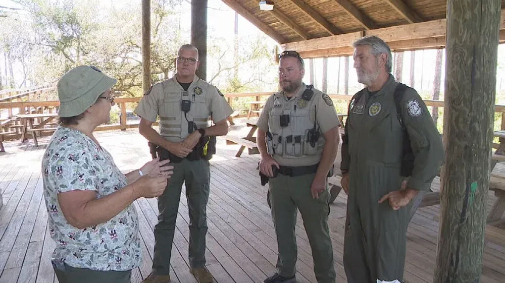 DeNell with FWC officers