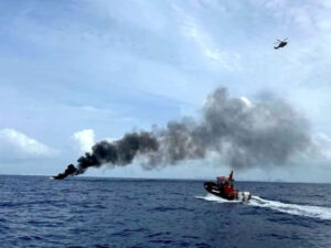 Coast Guard approaching a boat fire